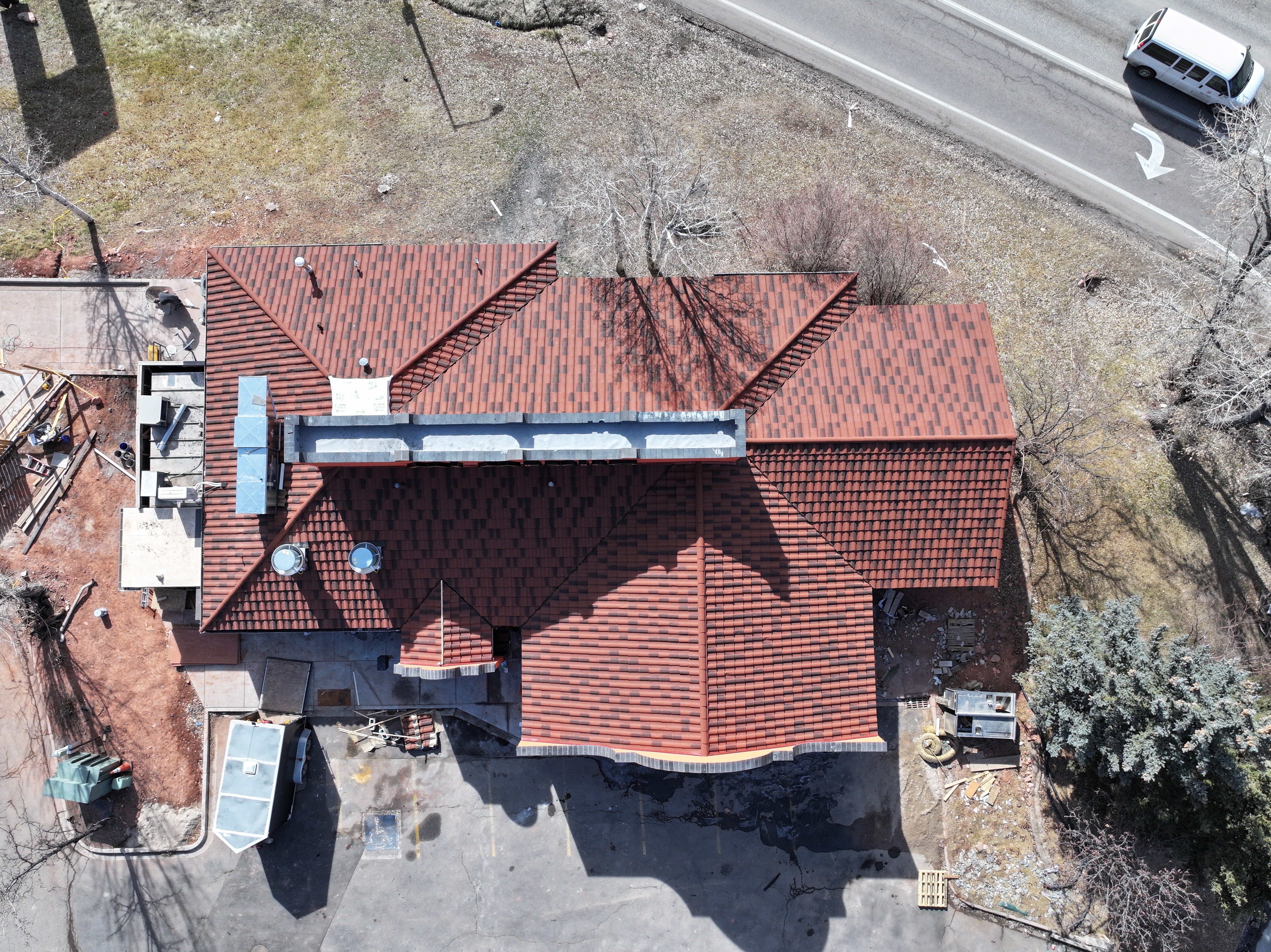 Aerial view of a completed roofing project