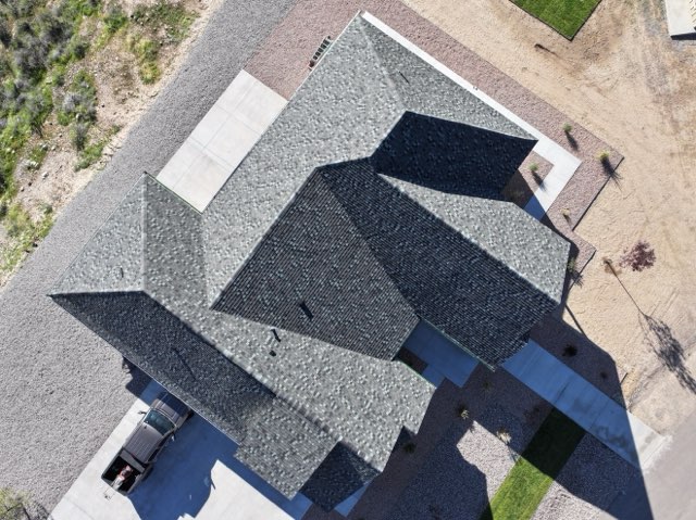 Aerial view of a new gray shingle roof
